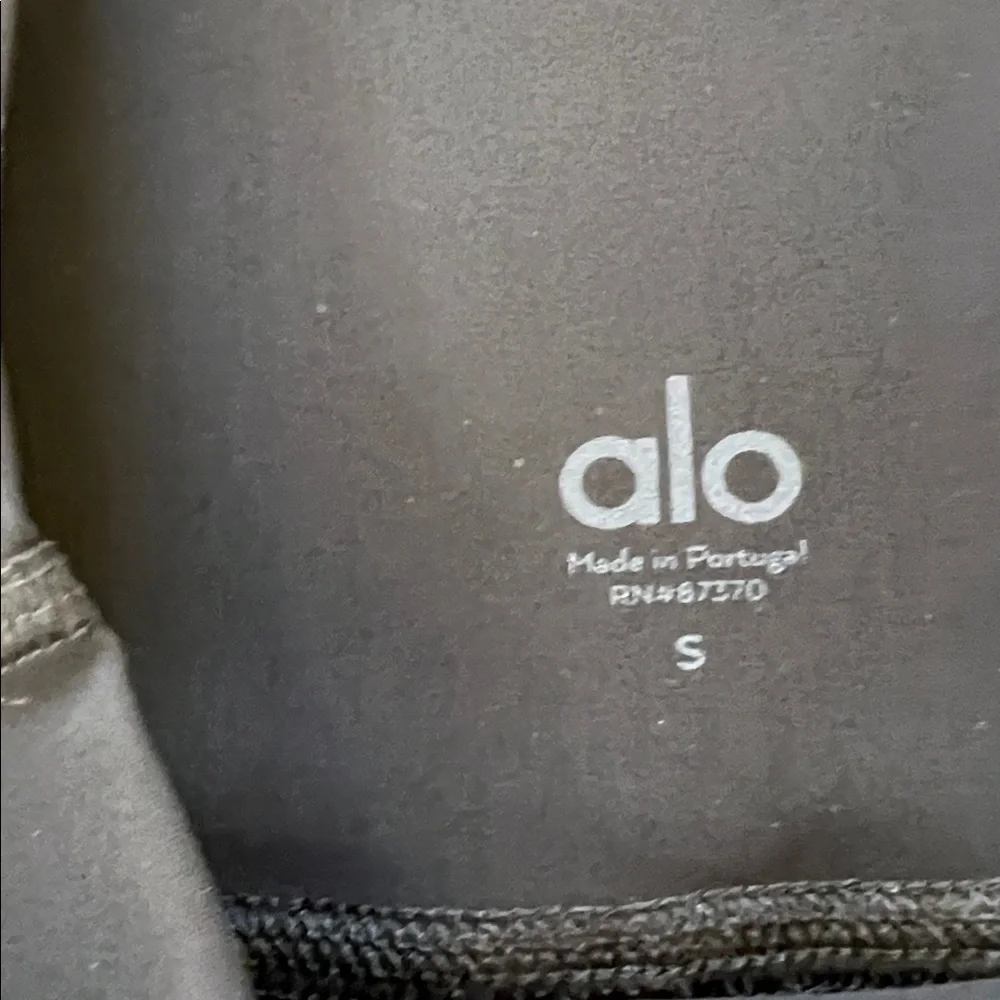 ALO Yoga black ripped high waist warrior leggings.